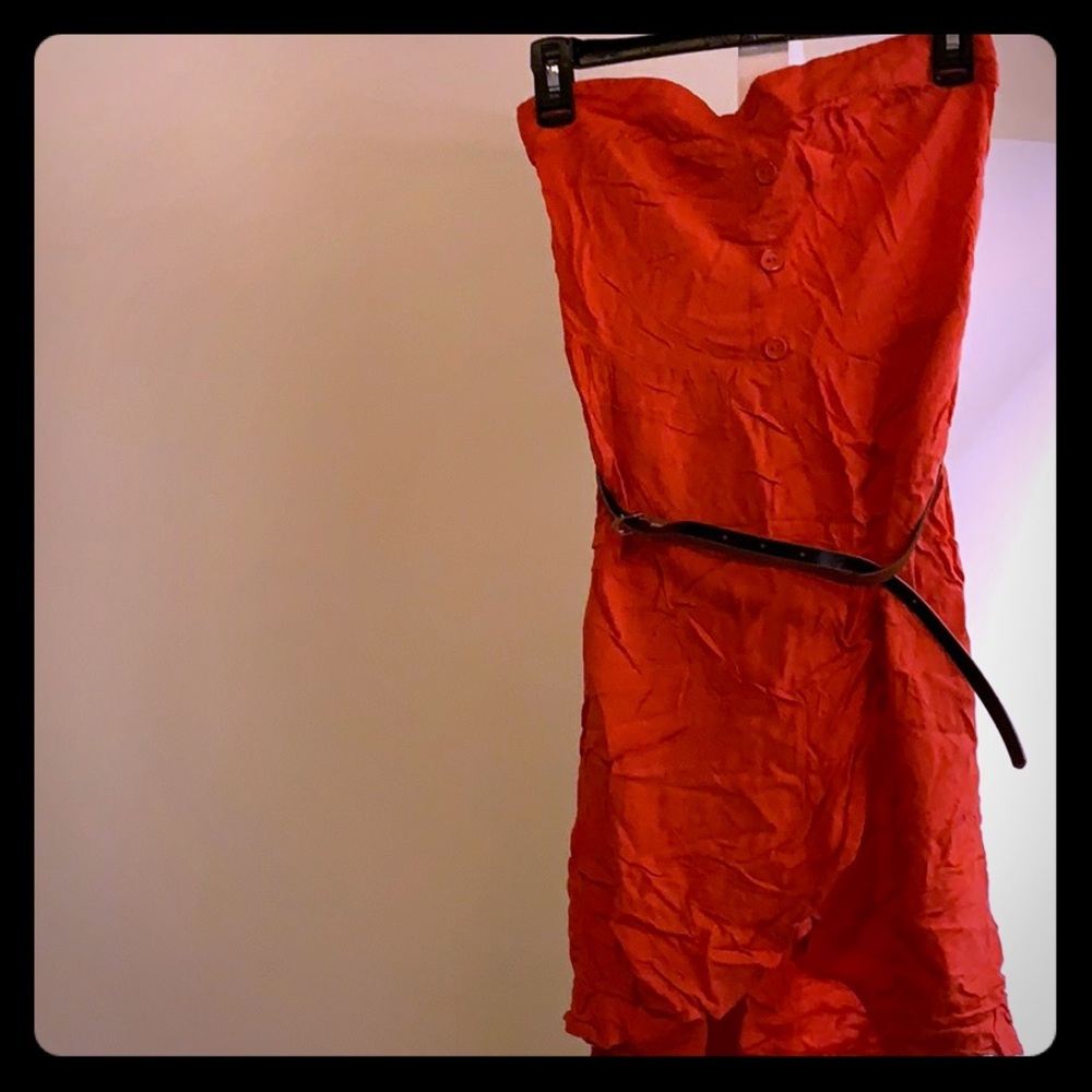 Orange strapless dress with brown belt